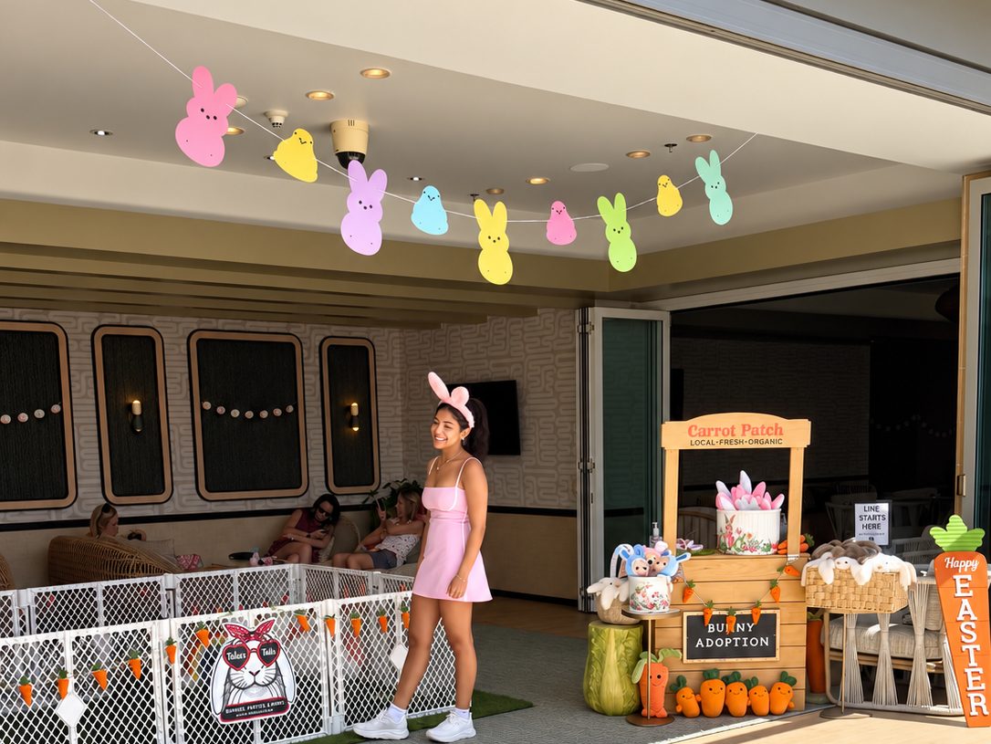 Talia's Tails Easter bunny party setup with bunny pen, Peeps garland and carrot stand